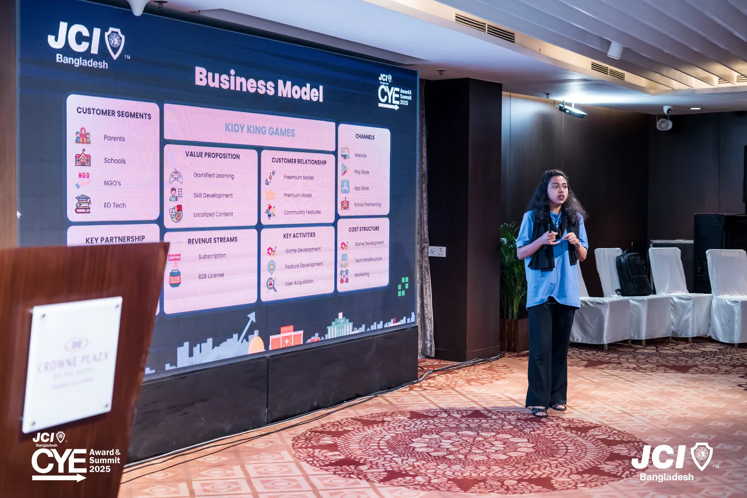 Suzana Haque Esha presenting the business model at JCI CYE Award & Summit 2025